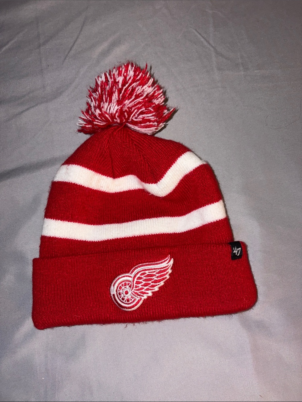 Red & White Striped Pom Beanie with Winged Wheel Patch toddler